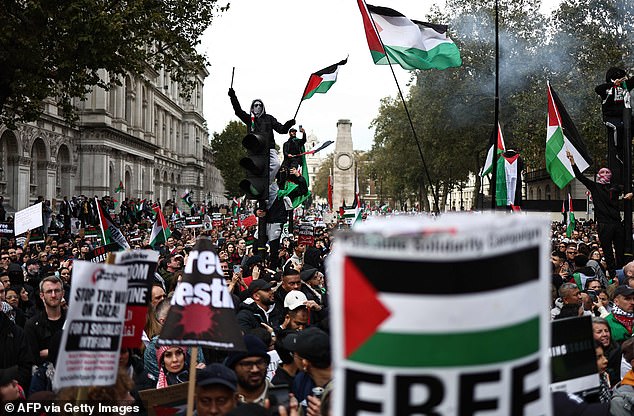People protest in Whitehall in support of Palestinians trapped in Gaza