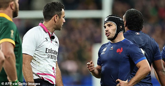 France's scrum-half and captain Antoine Dupont (R) speaks with New Zealand referee Ben O'Keeffe during the France 2023 Rugby World Cup quarter-final match between France and South Africa at the Stade de France in Saint-Denis, on the outskirts of Paris, on October 15, 2023. (Photo by FRANCK FIFE / AFP) (Photo by FRANCK FIFE/AFP via Getty Images)