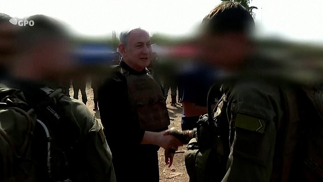 Netanyahu shakes hands with soldiers Israel Defense Force soldiers near the Lebanon border