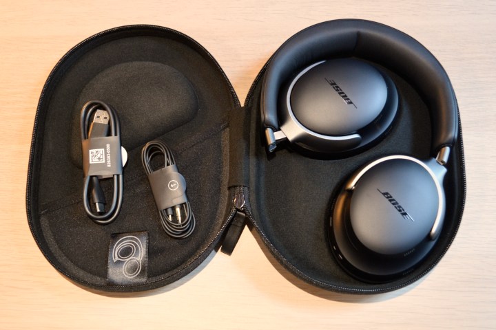 Bose QuietComfort Ultra Headphones in travel case with accessories.
