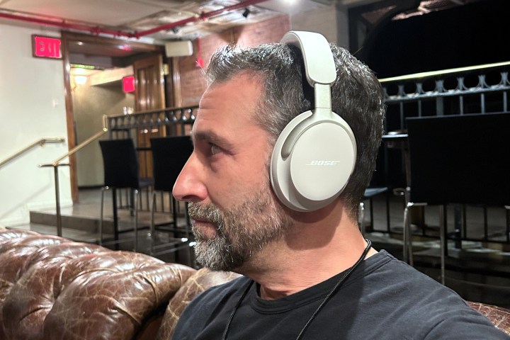 Simon Cohen wearing Bose QuietComfort Ultra Headphones in white.