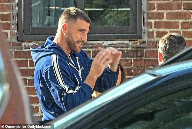 The NFL star was seen beaming on Monday afternoon after a whirlwind 24 hours that saw him praised for his performance on the field and celebrating with his superstar girlfriend