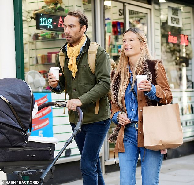 James and Alizee clutched onto coffees for their walk through Notting Hill