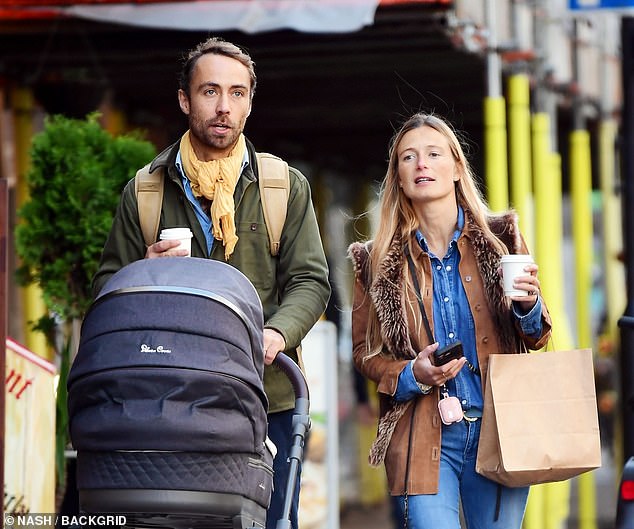 James and Alizee carried bags while pushing the child through the posh west London streets