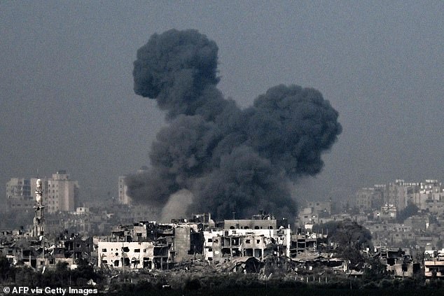Huge plumes of smoke rise from the site of an Israeli attack on Gaza on Saturday morning