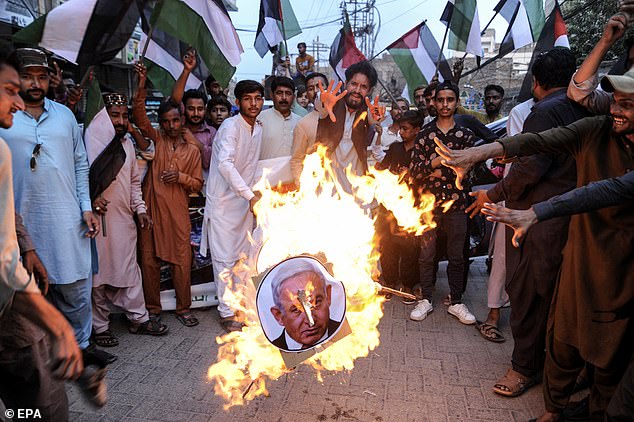 The Israeli Prime Minister was burned as a puppet during a rally of solidarity with the Palestinian people, in Hyderabad, Pakistan, yesterday