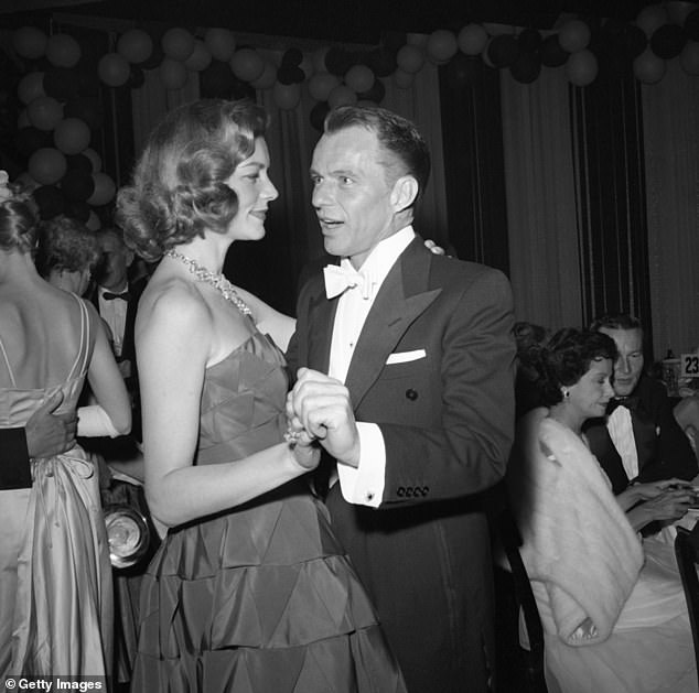 Frank Sinatra and Lauren Bacall dancing together at Hollywood event, circa 1955