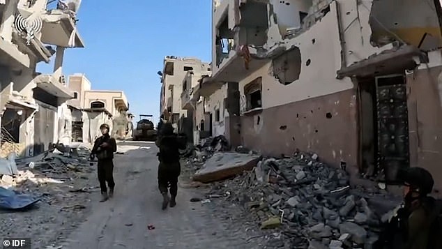 Video released by the IDF shows Israeli troops walking through the bombed out streets of northern Gaza