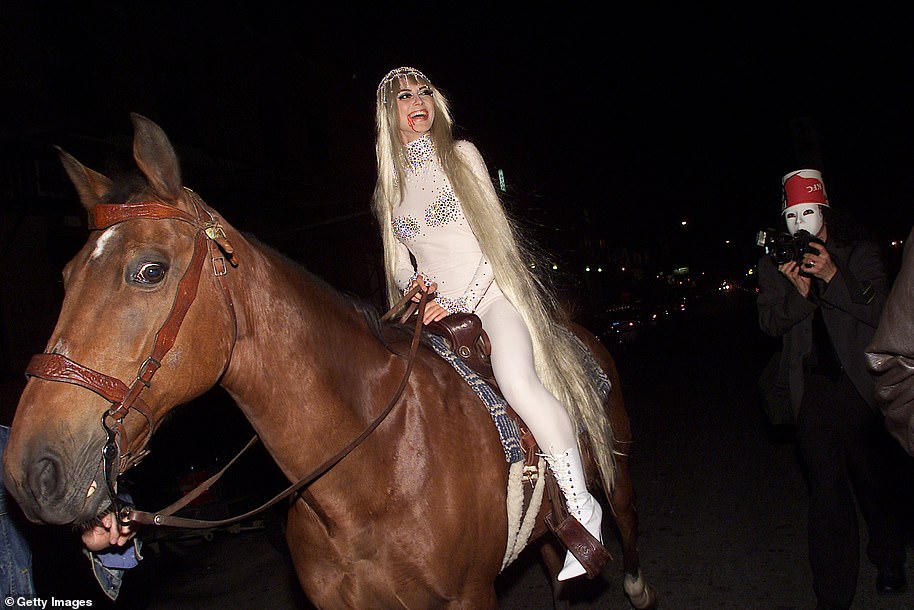 Giddy up: The star memorably arrived on horseback to her 2001 bash, as she dressed as a dead Lady Godiva