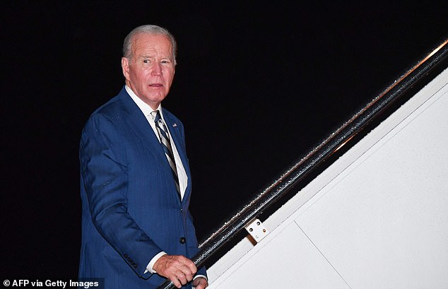 Joe Biden is seen on Friday night boarding Air Force One to travel to his beach house in Delaware for the weekend. He was asked whether he wanted Israel to slow its expected invasion of Gaza, to allow more time for negotiations over hostages, and replied: 'Yes'