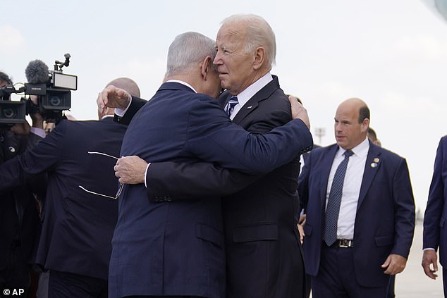 President Joe Biden is greeted by Israeli Prime Minister Benjamin Netanyahu after arriving at Ben Gurion International Airport, Wednesday