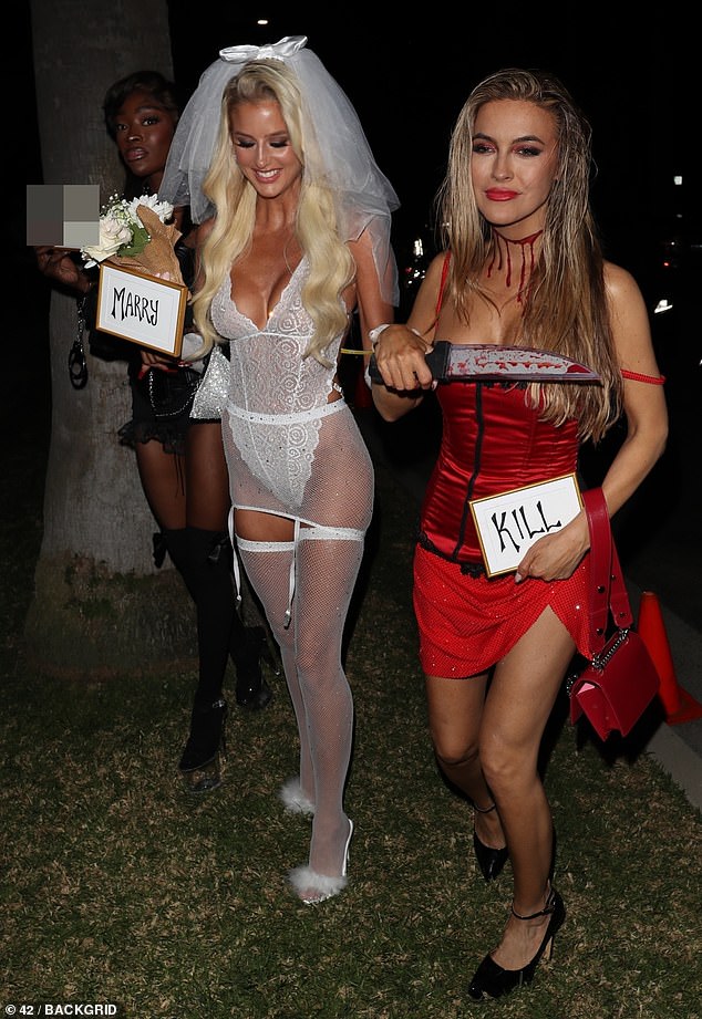 Hier kommen die Mädchen: Emma Hernan, 32, und Chrishell Stause, 42, begleiteten Chelsea Lazkani, 30, am Freitag als „f**k, marry or kill“ auf der Casamigos-Halloween-Party in Los Angeles