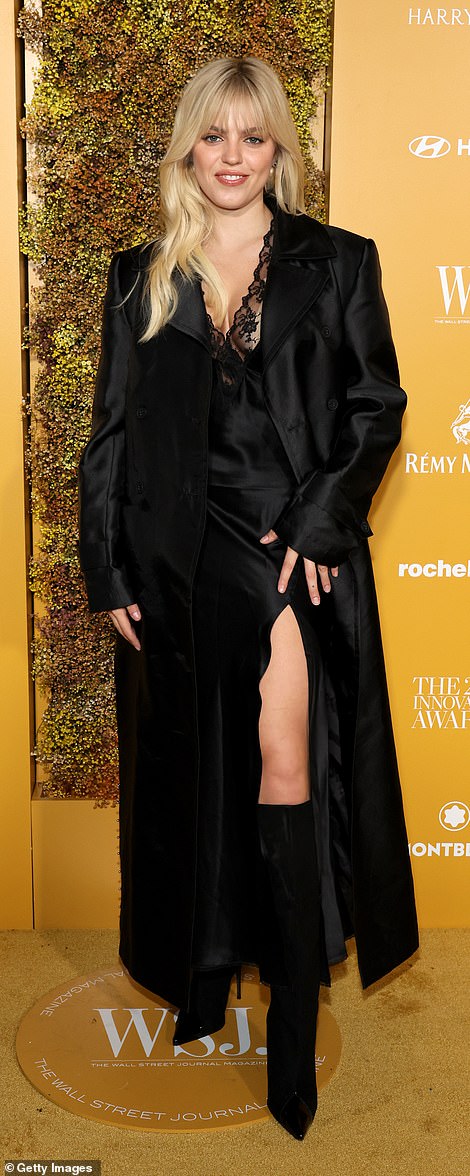 Eye-catching: Reneé Rapp, 23, sizzled in a black lace silk slip with a lace trim and a front slit