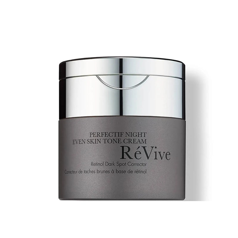 RéVive Perfectif Night Even Skin Tone Cream: Ein graues Glas mit silbernem Deckel und schwarzem Text auf weißem Hintergrund