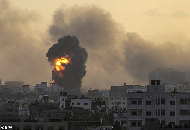 Smoke and flames rise following an Israeli strike on the Tal al-Hawa neighborhood in Gaza City