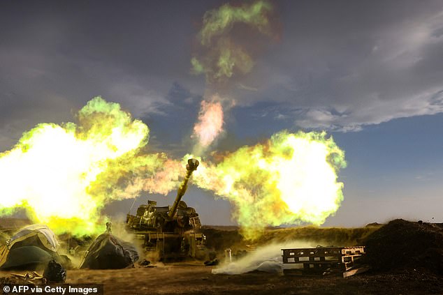 The terror group, like Hamas, is backed by Iran , and clashes across Israel's northern border are stoking fears of a broader conflagration of the ongoing war. Pictured: An Israeli artillery unit fires during a military drill in the Golan Heights near the border with Lebanon on November 2