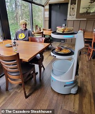 The robotic waiter is pictured