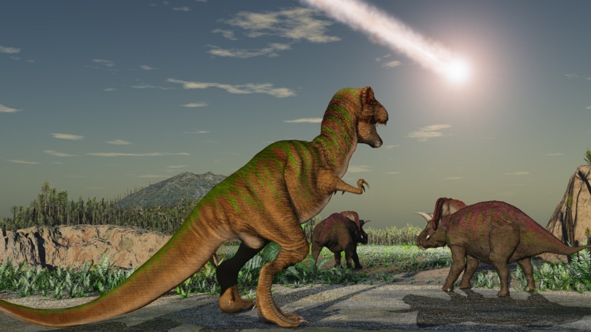 Illustration eines Asteroiden am Himmel über Dinosauriern