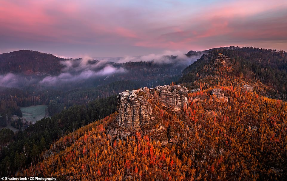 This spellbinding image shows the Bohemian Switzerland National Park, which sprawls over a section of the Elbe Sandstone Mountains in the Czech Republic. 'This is a wonderful place to walk, there are numerous hiking trails,' says travel site Amazing Places, adding: 'And you have the chance to encounter animals such as foxes, red deer, roe deer, badgers and wild boar'