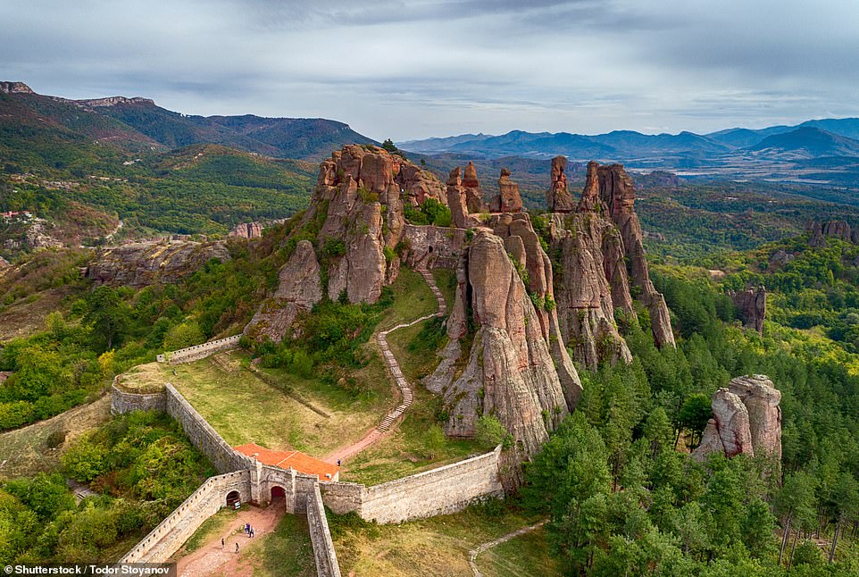 This is the striking Belogradchik Fortress - also known as the Kaleto Fortress - in Bulgaria. It 'was originally built by the Romans and later expanded by the Byzantines, Bulgarians and Turks', Lonely Planet notes, adding: 'You can wander round three courtyards and explore the defensive bunkers; accessing the highest rocks involves a precarious climb up steep ladders'