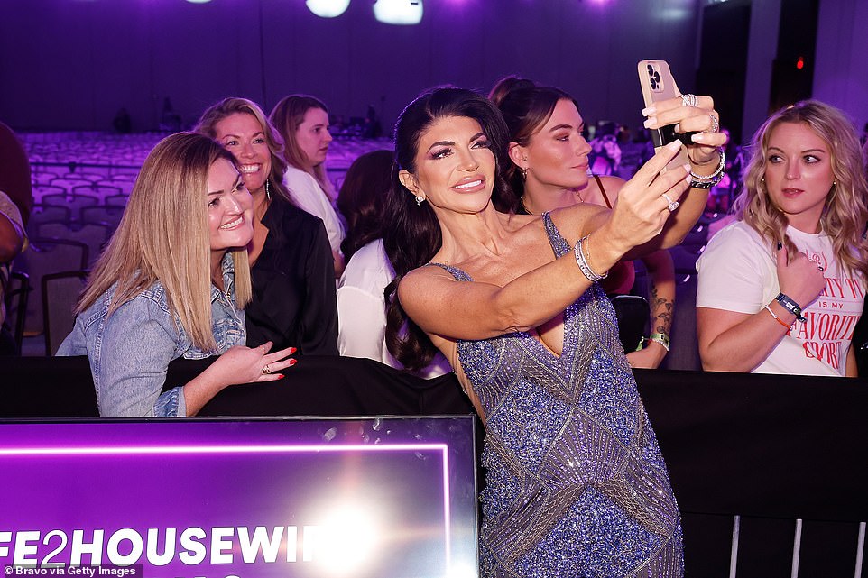 With fans: Teresa happily snapped selfied with fans
