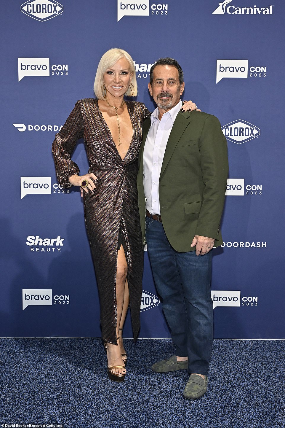 Cute pair: Margaret Josephs, 56, wore a plunging metallic gown for the occasion, as she posed with husband Joe Benigno