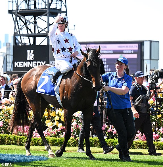 epa10961464 Jockey Zac Purton (C) returns to scale after riding  Dublin Down to victory in race 1, the Darley Maribyrnong Plate during Melbourne Cup Day at Flemington Racecourse in Melbourne, Australia, 07 November 2023.  EPA/JAMES ROSS AUSTRALIA AND NEW ZEALAND OUT