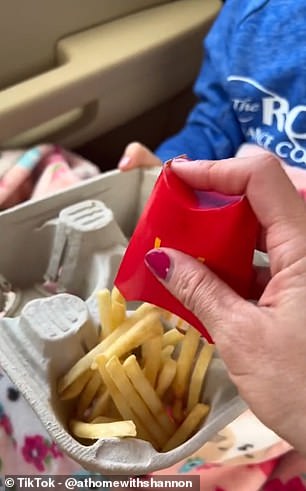 In her TikTok, the mom-of-four shows how cardboard drinks containers can be used to 'hold and separate your food'