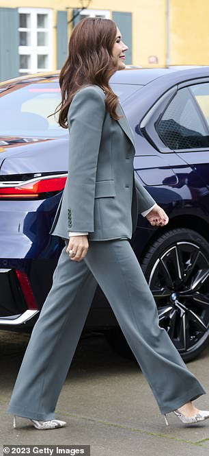 She means business! Denmark's Princess Mary looked typically stylish in her green trouser suit