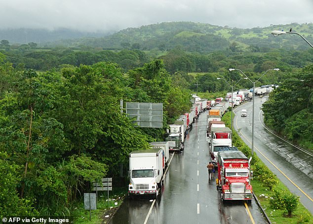 Trucks are seen stranded near Sillimin, western Panama, on Tuesday as the protests entered their third week