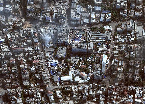 This handout satellite picture released by Maxar Technologies on November 12, 2023, shows the damage arround the Shifa Hospital in Gaza City's al-Rimal district. More than 10,000 people have been killed in relentless Israeli bombardment of the Gaza Strip, according to the Hamas-run health ministry, since the war erupted after Palestinian militants raided southern Israel on October 7 killing at least 1200 people, according to official Israeli figures. (Photo by Satellite image Â©2023 Maxar Technologies / AFP) / RESTRICTED TO EDITORIAL USE - MANDATORY CREDIT "AFP PHOTO / Satellite image Â©2023 Maxar Technologies" - NO MARKETING NO ADVERTISING CAMPAIGNS - DISTRIBUTED AS A SERVICE TO CLIENTS - THE WATERMARK MAY NOT BE REMOVED/CROPPED - (Photo by -/Satellite image Â©2023 Maxar Tech/AFP via Getty Images)