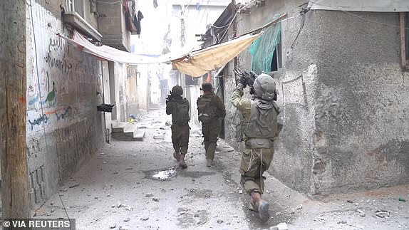 Israeli soldiers take part in an operation amid the ongoing conflict between Israel and Hamas, at a location given as Al-Shati, Gaza, in this still image taken from video released November 14, 2023.    Israel Defense Forces/Handout via REUTERS    THIS IMAGE HAS BEEN SUPPLIED BY A THIRD PARTY. REUTERS WAS NOT ABLE TO CONFIRM THE LOCATION OR THE DATE THE VIDEO WAS FILMED.
