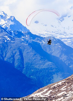 No experience is required for a tandem paraglide ride in Zermatt (pictured). Just hang on tight