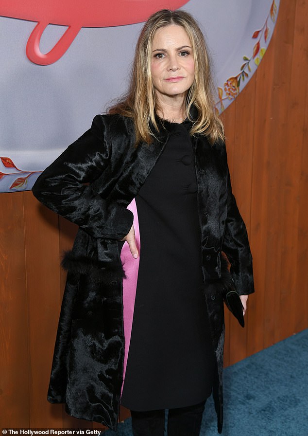 Chic: Jennifer Jason Leigh — who plays Dot's mother-in-law, Lorraine Lyon — arrived in a demure black midi dress that hugged her svelte frame