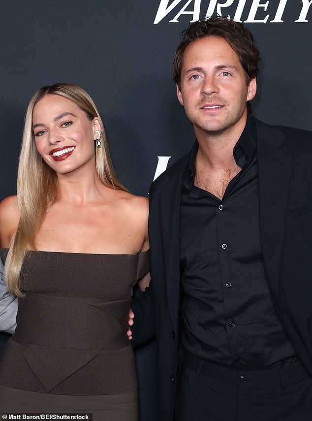 Actress Margot was joined by her husband Tom Ackerley, 33, for the bash in Los Angeles last night