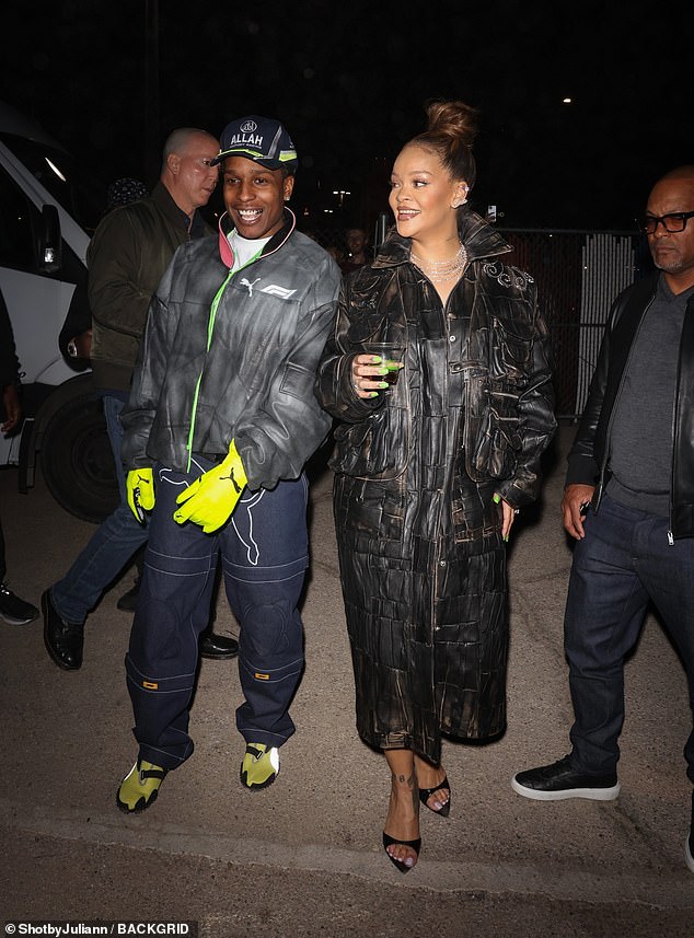 Rihanna and A$AP Rocky surprised fans at the launch - both wearing rugged leather jackets as they entered into the spirit of the event