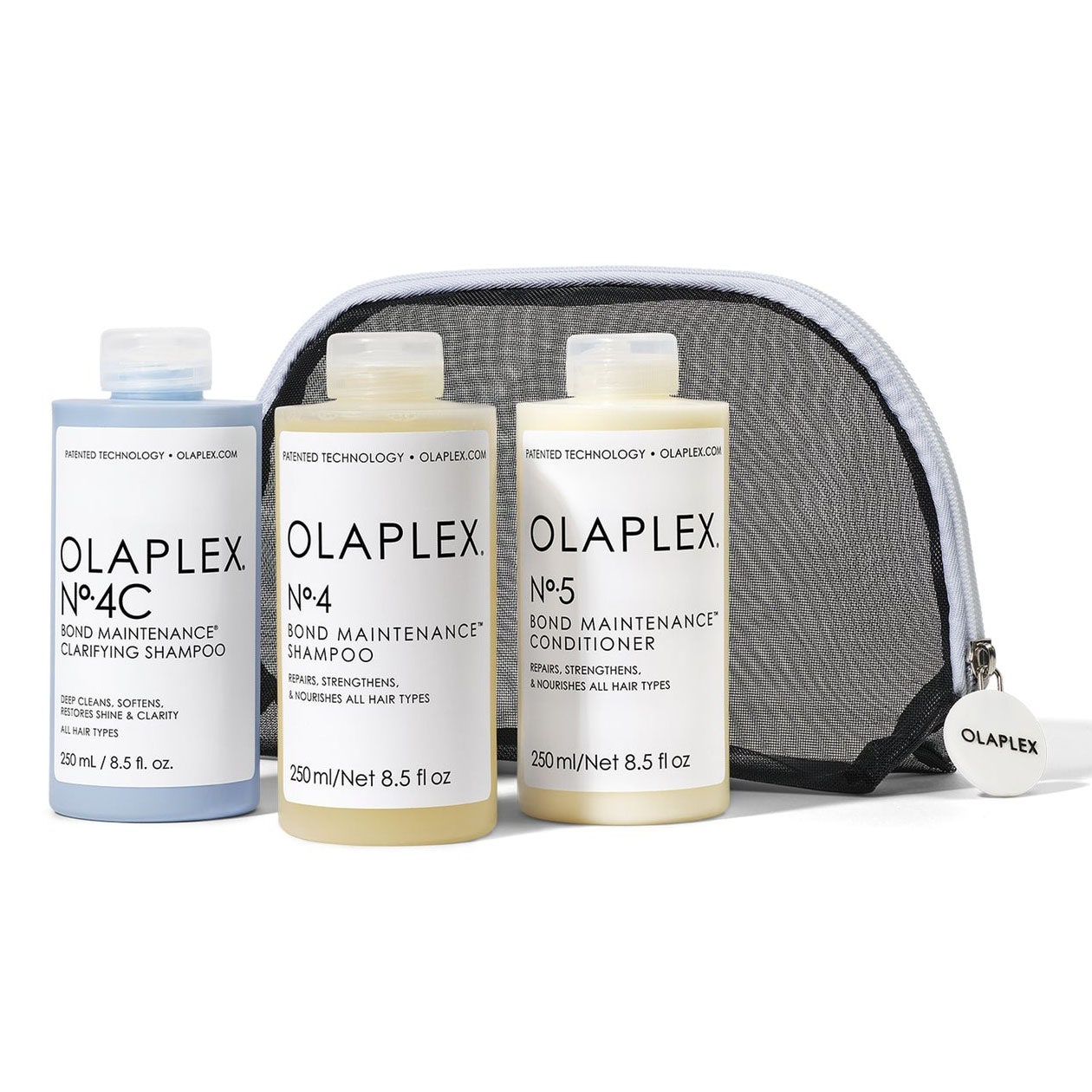 Olaplex Complete Cleansing Kit, drei Flaschen und Netzbeutel auf weißem Hintergrund
