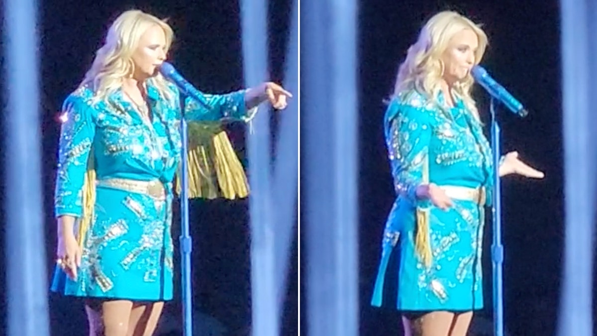 Miranda Lambert in einem blauen Kleid mit Fransen zeigt in die geteilte Menge. Miranda Lambert streckt ihre Arme nach beiden Seiten aus, die Handflächen nach oben