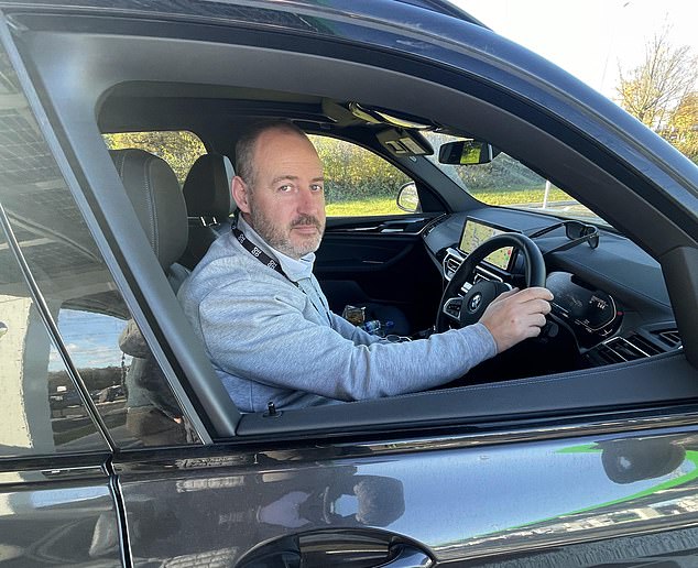 Salesman Jamie Stevens, 44, was eating his sandwiches as his car charged at one of the super-fast charging stations, which can charge the average vehicle in roughly 15 minutes