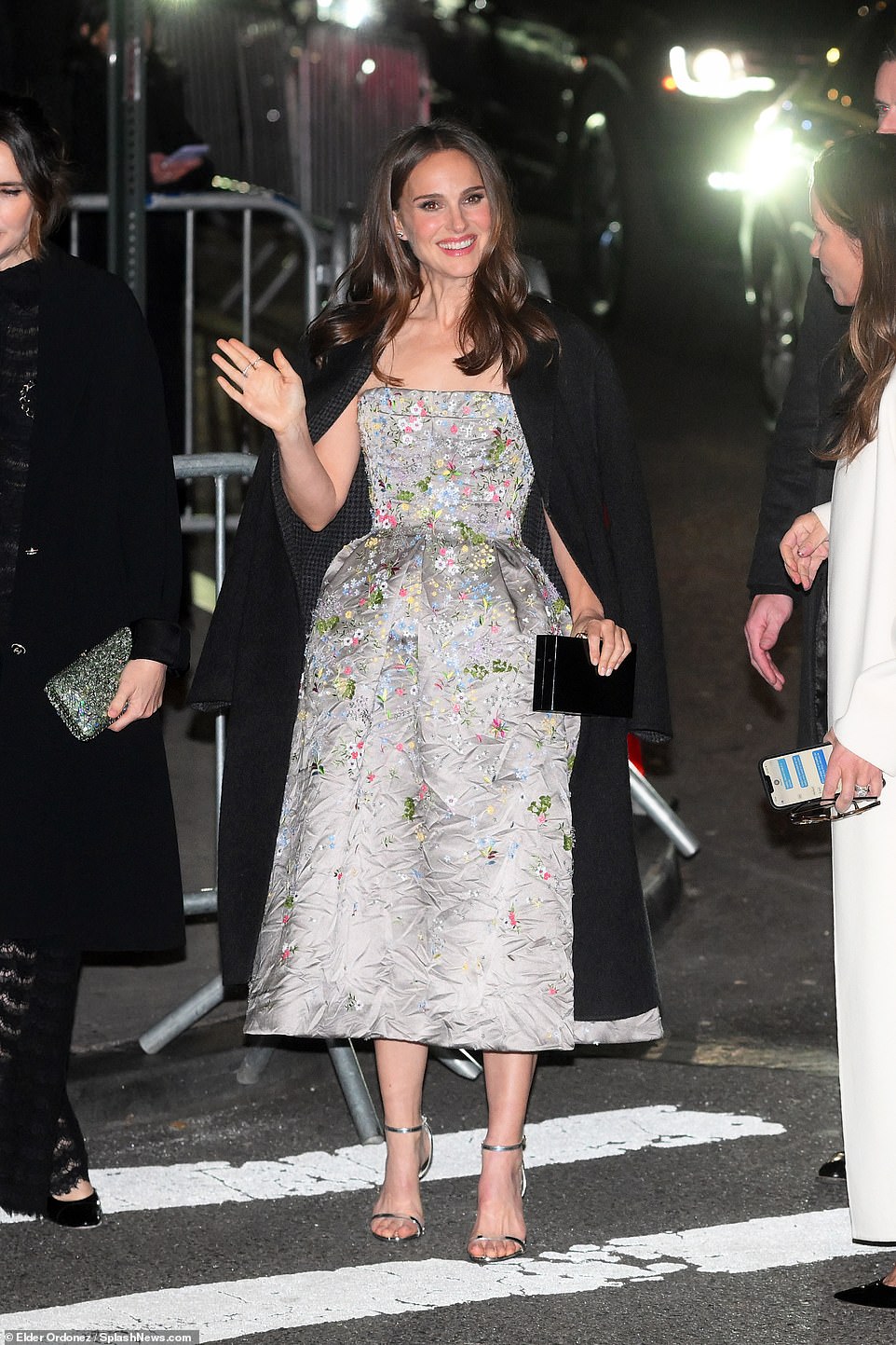 Friendly: Portman waved to fans as she arrived to the awards show
