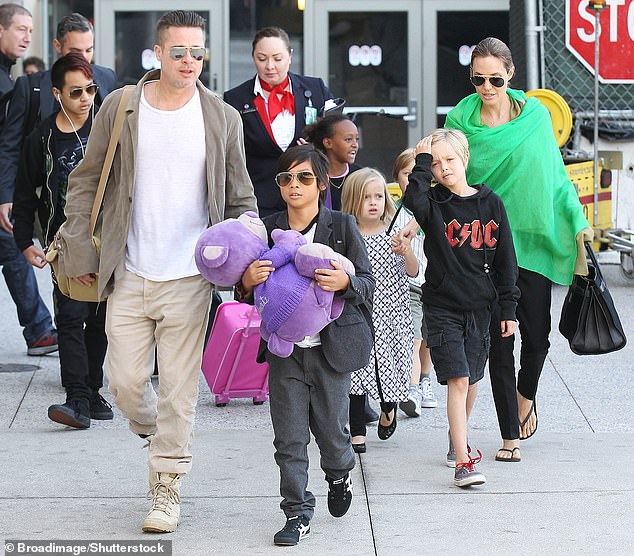 Brad Pitt and Angelina Jolie are pictured with their children Maddox Jolie-Pitt, Shiloh Jolie-Pitt, Pax Jolie-Pitt, Knox Jolie-Pitt, Vivienne Jolie-Pitt and Zahara Jolie-Pitt at the LAX Airport in Los Angeles, California in June 2014