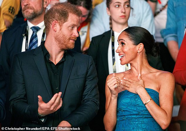 The Royal Family is understood to be 'considering all options', including legal action. Pictured: Harry and Meghan at the Invictus Games in September