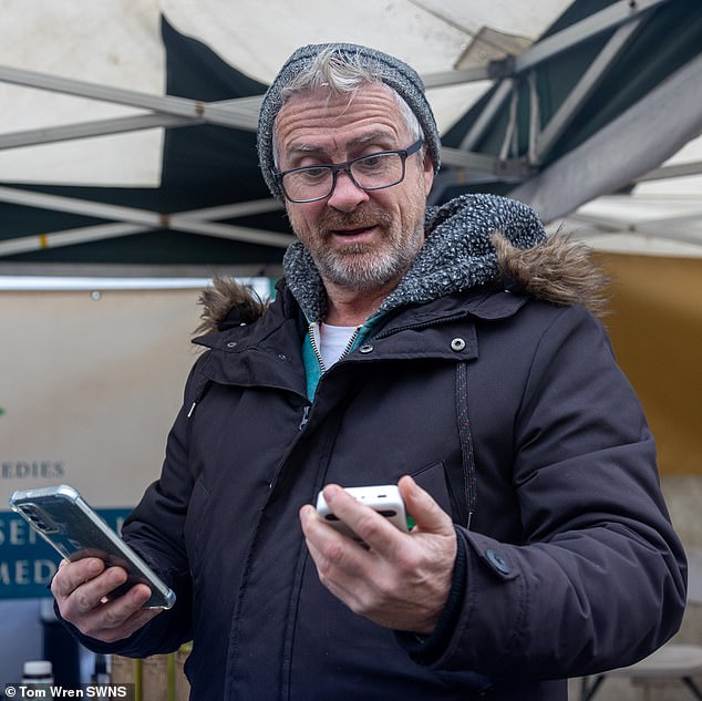 Adam Kelly, 57, claims he has lost sales because the phone reception doesn't work in Glastonbury