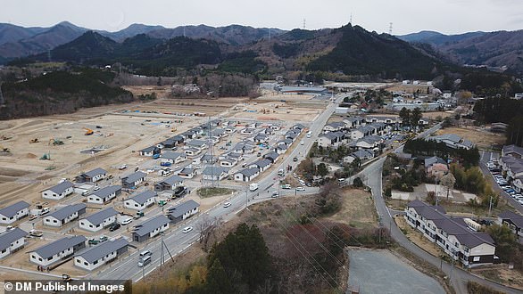 Die Luftaufnahme zeigt den laufenden öffentlichen Wohnungsbau im Bezirk Okawara, wo die Regierung 2019 eine obligatorische Evakuierungsanordnung aufgehoben hat