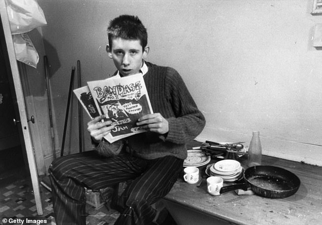 Shane MacGowan, then editor of punk rock magazine 'Bondage', in his office at St Andrews Chambers, Wells Street, London