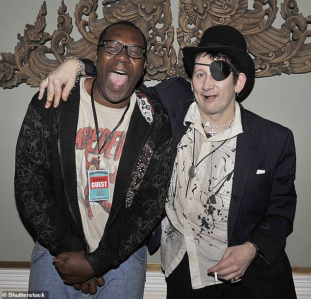 MacGowan with comedian Lenny Henry at an event in Dublin in 2010