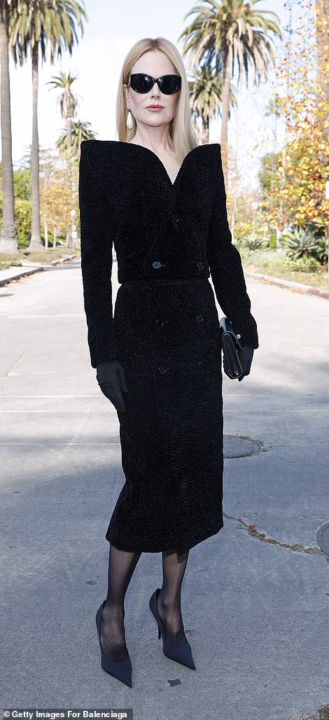 Kidman, 56, looked classy in a black velvet coat dress with a stylish open-shoulder design