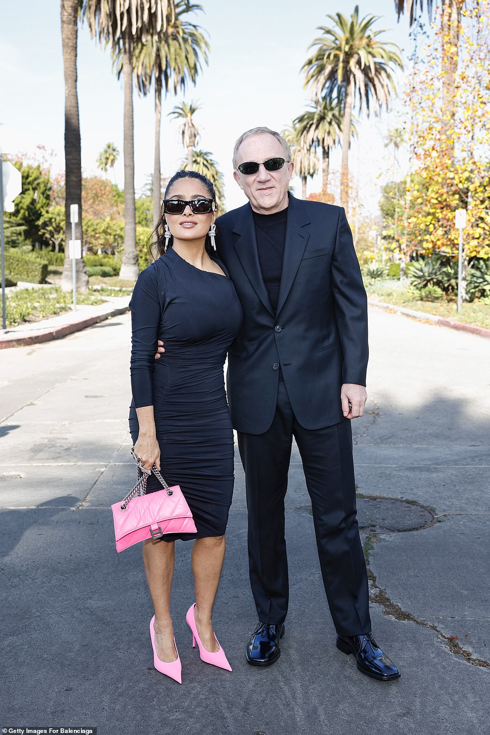 The CEO of Kering looked dapper in a black suit, black shirt and sunglasses