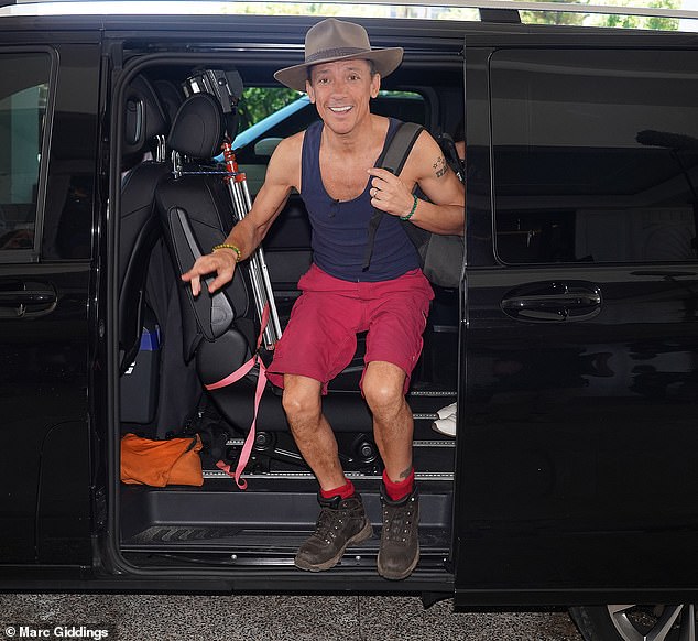 He didn't seem too upset by being ousted from the Jungle as he flashed a giant smile while arriving at the luxury Marriott Hotel in Surfer's Paradise