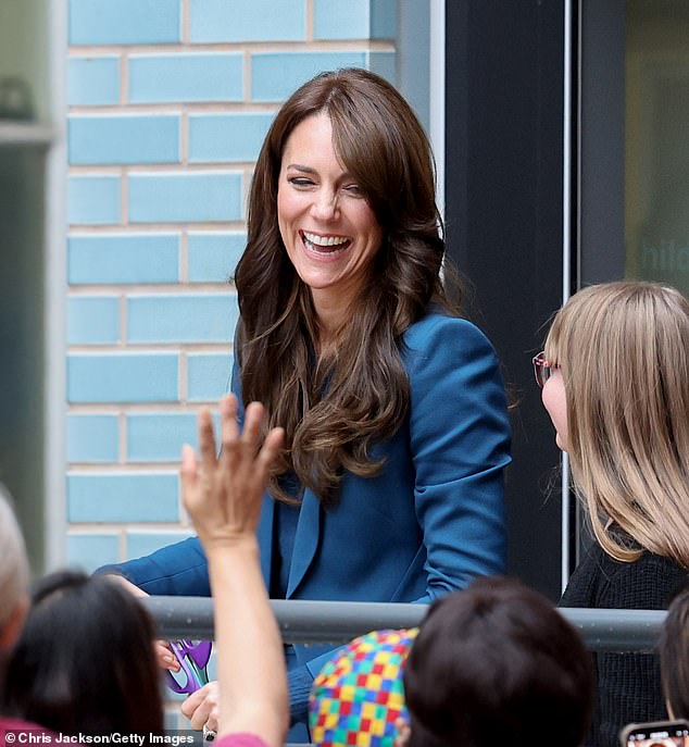 Proving she is the children's princess, Kate looked delighted among the crowds of school kids